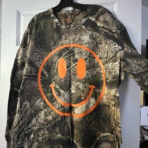 Dressed in LALA Camo Long Sleeve with Orange Smiley